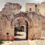 Metal gate in an old stone wall