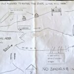 A piece of white paper with routes drawn on it and text in English.