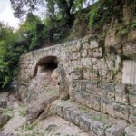 among the trees you can see an old Roman bridge made of stone